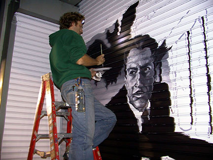 Artist painting the Vincent Price Door