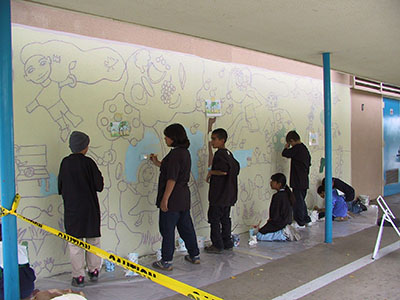Students beginning work on the mural